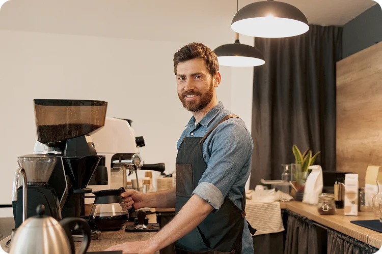 a man making coffee